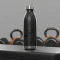 HydroMax matte black insulated gym water bottle on gym bench